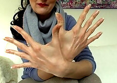 Elegant brunette Victoria Valente shows off her lovely hands and long nails in a cozy cashmere outfit