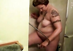 Bulky babe gets moist and soapy in shower