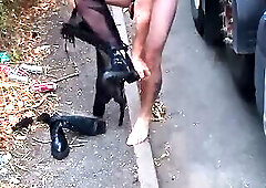 Cock locked sissy sucking dildo outdoors