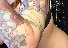 Redhead swallows a toy ramrod and vibrates her love button