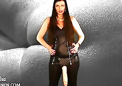 Playful shemale wears her sexy dress while teasing with strapon