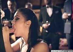 Latina  gets hired to entertain a mens party so she gets on her knees and sucks a big cock in public.The guy deepthroat facefucks her and then gives o