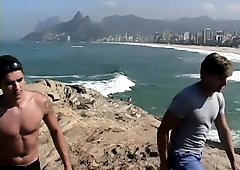 Two hot guys are on vacation and go in from the beach for a little dick play