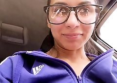Nerdy amateur brunette drives herself to climax in the car