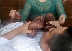 Mature dame in black nylons is petting her paramour's meatpipe while he is idolizing her soles