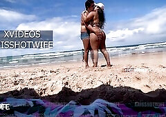 Kriss Hotwife In Micro Bikini Showing Off On Public Beach With Her Tame Horn On The Side