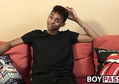 black youthfull guy gives an interview and stimulates himself