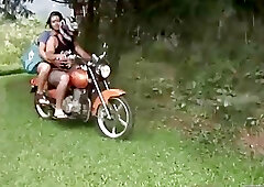 Dirty tranny gets ass fucked on a motor bike outdoors