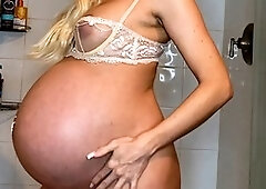 Worshipping the big belly of a pregnant taboo blonde in a steamy JOI session