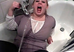 Clothed pissed on in bathtub