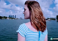 Redhead Emma Johnson fingers herself openly on a sunlit yacht