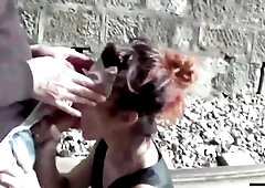 Banged between the railway tracks this babe gets a large gulp of cum