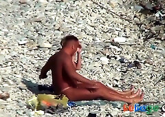 Tanned couple in pink thongs take their anal play to a rocky public beach