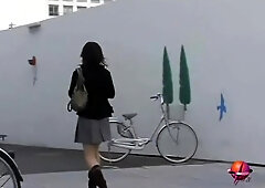 Cute Asian in boots got skirt sharked and undies seen