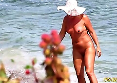 Dirty minded milfs are completely naked on the beach, because they like the feeling of it