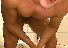 Handsome man jerks in tub