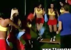 Transsexual cheerleaders practicing their cheering moves