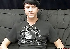 Young gay man jerks off his giant dick during an interview