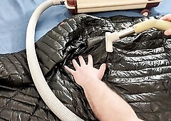 Vacuuming Darksome Shark Ghost Whisperer Down Jacket with Vintage Electrolux Vacuum Cleaner