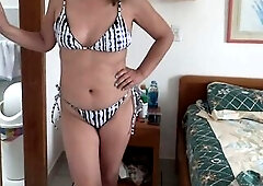 Stepmother on the beach in a bikini is looking for a well-hung boy to bang her