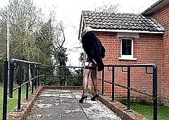 Transsexual tgirl doxy Gina outdoors wearing ebony pvc, nylons, high heels squirting and stroking