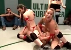 Hot girls in bikinis are having a wrestling match and fucking each other with a strap-on