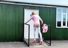 Crossdressing transsexual Gina Trent outdoors in Pink pvc stroking and cumming