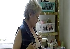 Gray haired granny with glasses disrobe and playng with Vibrator on her unshaved snatch