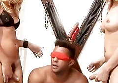 Muscle Guy submits himself to two hot shemales