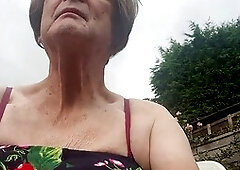 Mature beauty Betty Spanxxx enjoys some solo fun in the garden