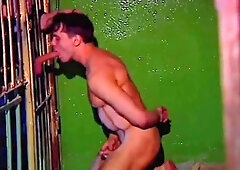 Stunning Hunk Is Sucking A Hard Boner Through The Cage