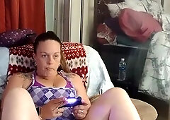 Filming up girlfriends minidress during the time that that babe smokes and plays movie games in her soaked juicy pants