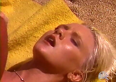 Stephanie Rage takes Peter North deep on the beach in vintage outdoor heat