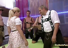 Heavily pierced blonde embraces gangbang at wild German party