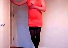 Stripping out of my orange minidress in black hold up stockings