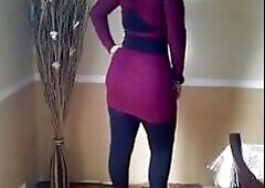 A steamy amateur video featuring a beautiful woman with a unique mix of Turkish, Arabic, and Asian heritage, wearing a hijap and posing sensually for 