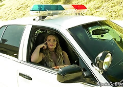 Hot porn actress Cali Carter gives an interview sitting in a police car
