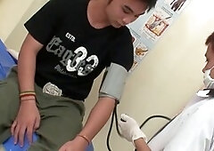 Young Asian guy gets his junk played with by the doctor