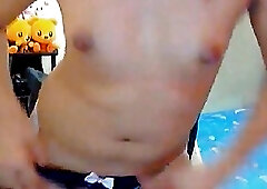 Flat chested Asian tranny wanks her hard cock on webcam