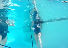 Blonde and brunette enjoys lesbian sex under the water