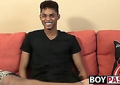 Black young man gives an interview and stimulates himself
