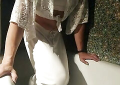 Moist in shower in white garments and underclothes...