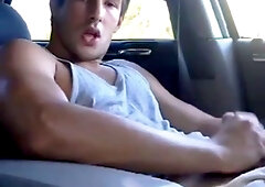 Big-cock jock strokes in his car