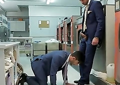 Two suited businessmen fuck hard in the factory