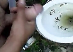 Naughty guy pissing outdoor