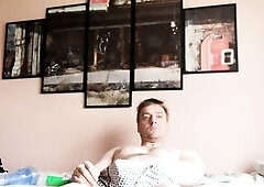 Lying on a daybed screwing a turbo ignition Fleshlight sideways perspective