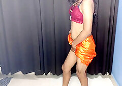 Stunning Indian stepmom Rossy Bhabhi in an orange petticoat and sexy hooter-sling