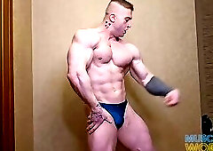 Massive Muscle God Flexes Hard Muscles Up Close