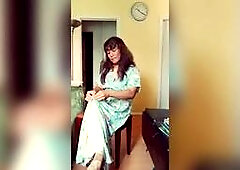 In a dress, high heels