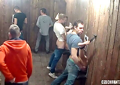 Czech naturals in a rustic wooden room with group of men and women